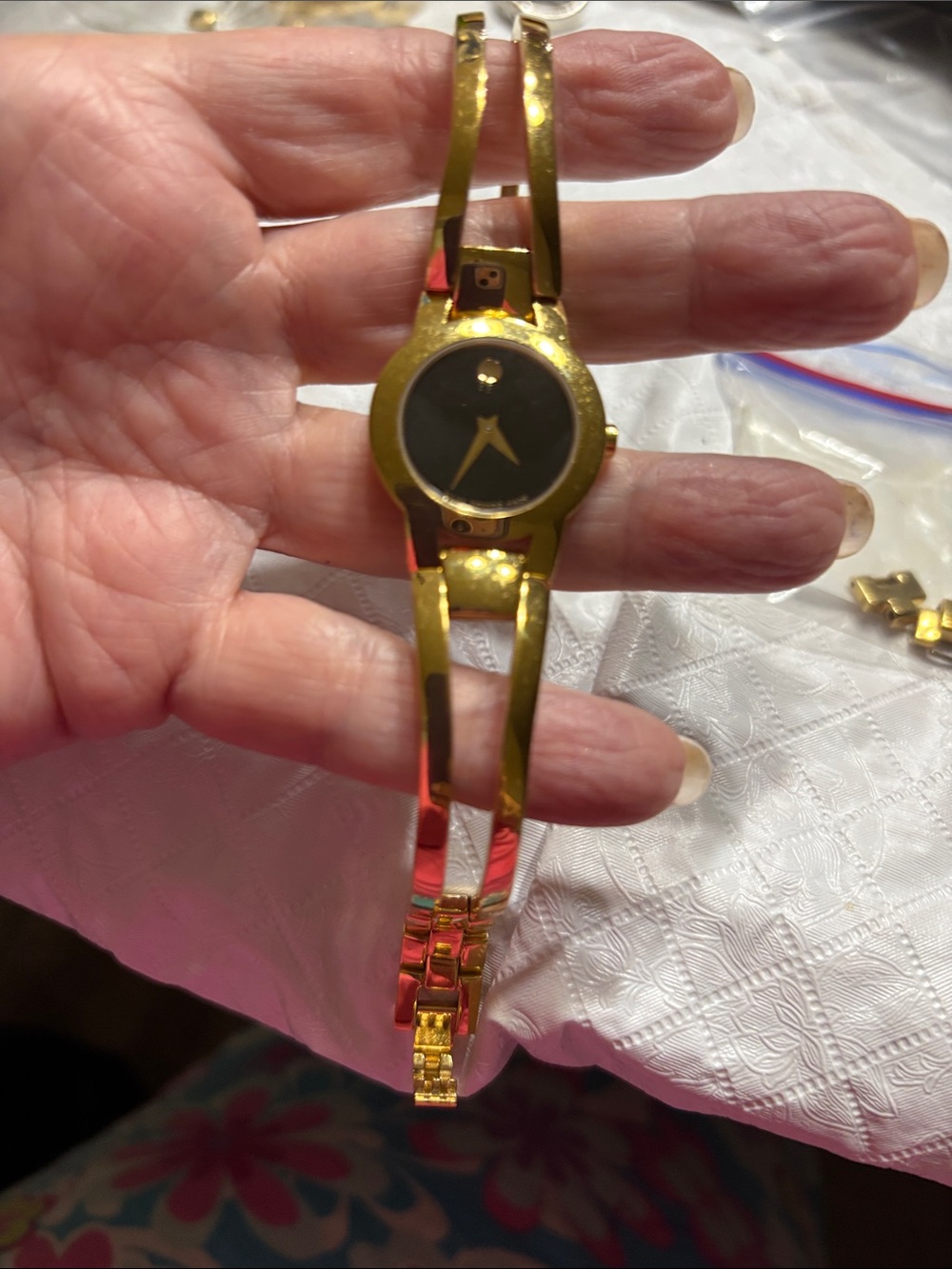 Ladies Movado Amorosa bangle style gold tone case and bracelet